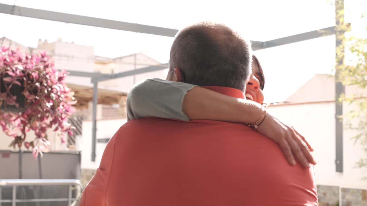 Happy family embrace at a reunion in a home