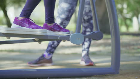 Cropped-shot-of-woman-training-on-orbitrek-in-park