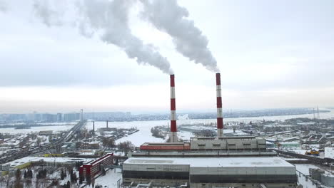 Aerial-view-smoking-chimneys-on-power-plant-on-winter-city-landscape