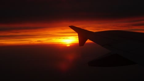 seing the sun rising from the window of a plane.