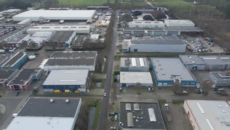 aerial of car driving over street on industrial terrain