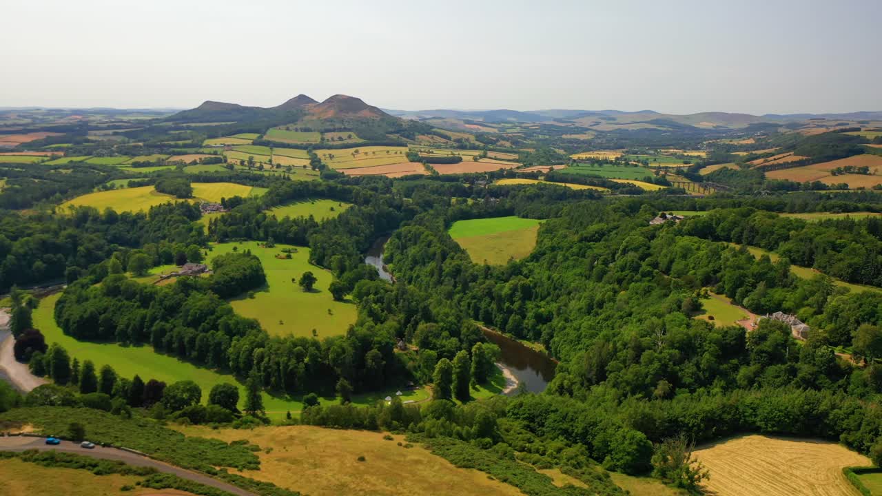 Aerial Pan of Scottish Countryside on Summer's Day, The River Tweed and Eildon Hills, Scottish Borders, Scotland