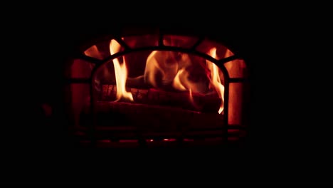 Fire-In-The-Fireplace-In-A-Dark-Room---Close-Up