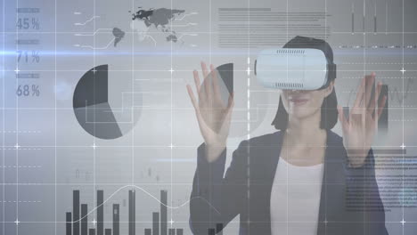 wearing vr headset, woman interacting with virtual data and graphs over animation