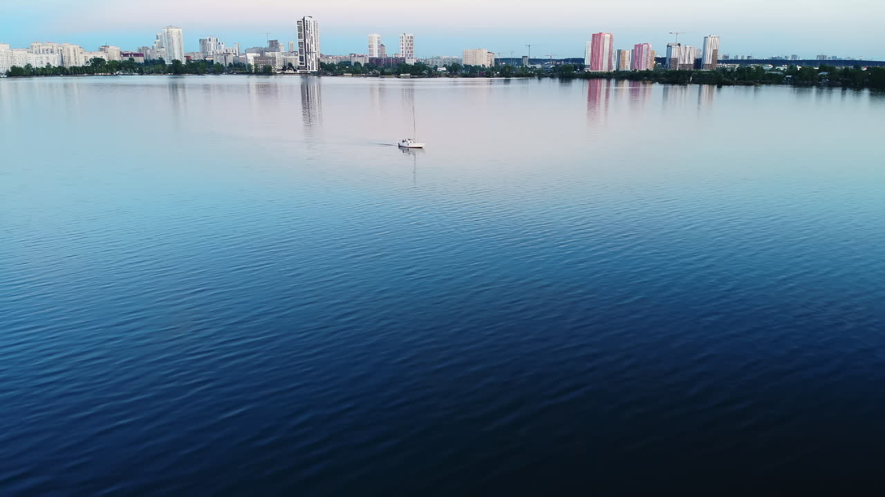 Sailboat on a Lake with City Skyline