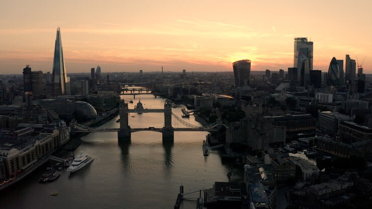 Aerial view of London, River Thames and Tower Bridge just after the sun has set and the sky is lit