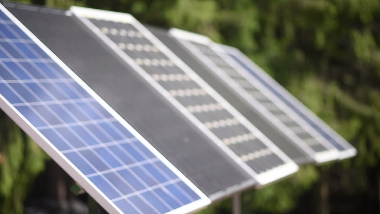 Solar panels are capturing sunlight to produce renewable energy. The clear blue sky enhances the effectiveness of these eco-friendly systems