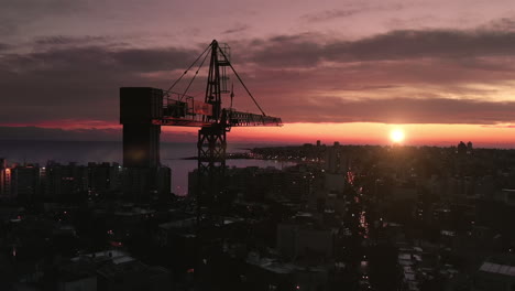 construction crane in the city at sunset