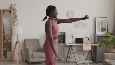 african sportswoman exercising at home