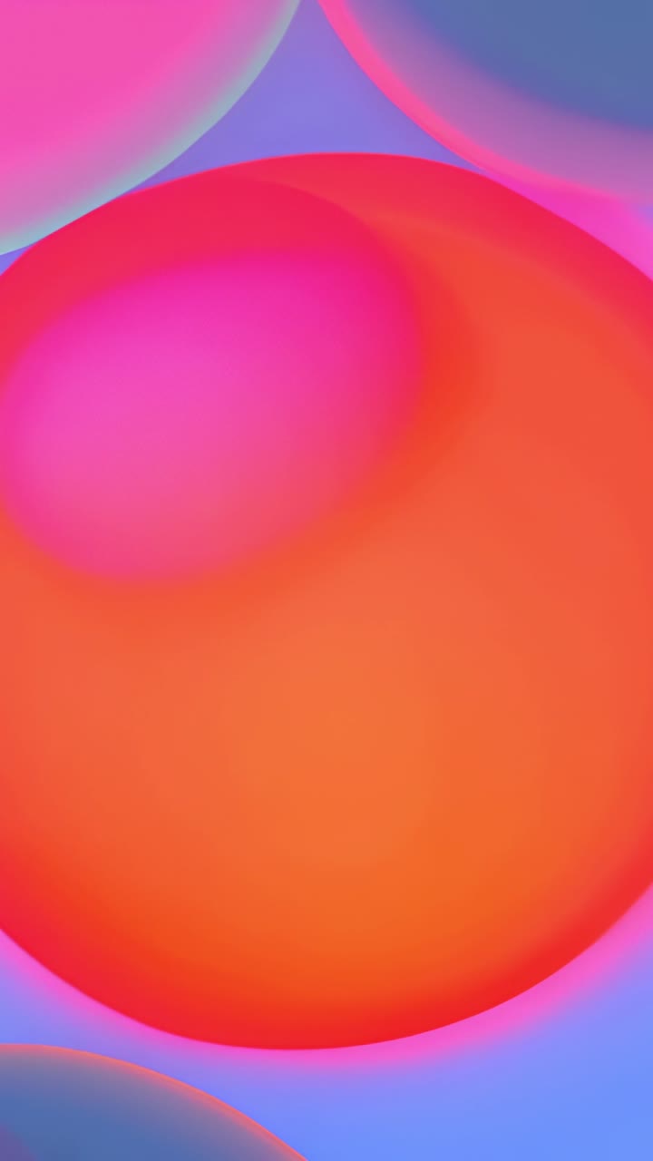 Vertical video: Showing orange sphere pulsing magenta glow in gradient, pink, blue spheres peeking