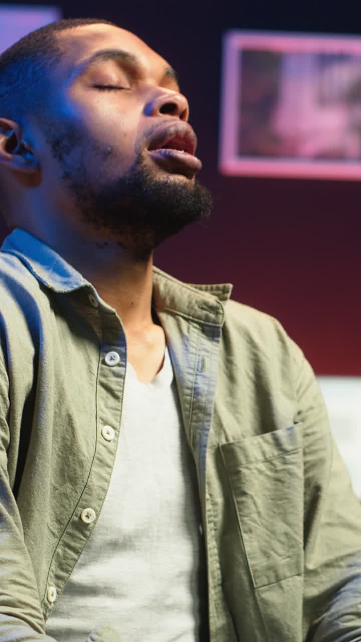 Vertical Video African american person receiving some bad news while doing remote work tasks