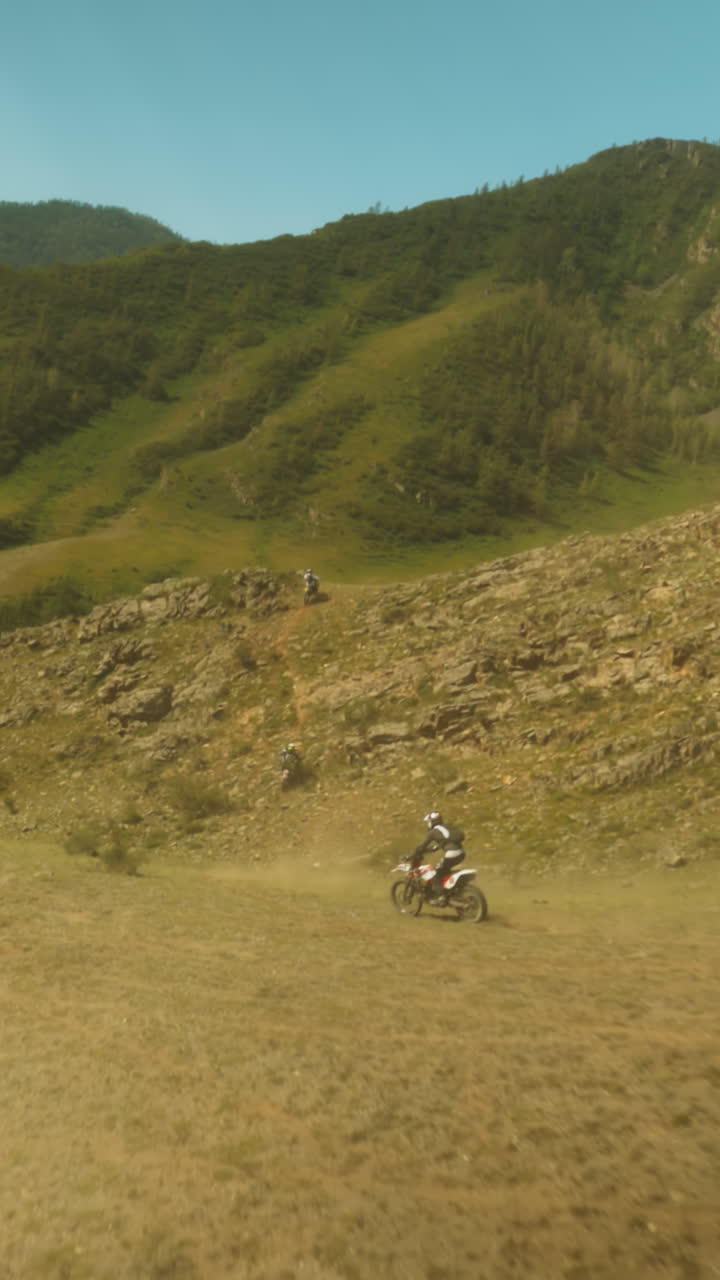 Adrenaline-fueled race of motorcycles. Motorcyclists push limits battling terrain and each other for coveted victory. Steep inclines of mountain
