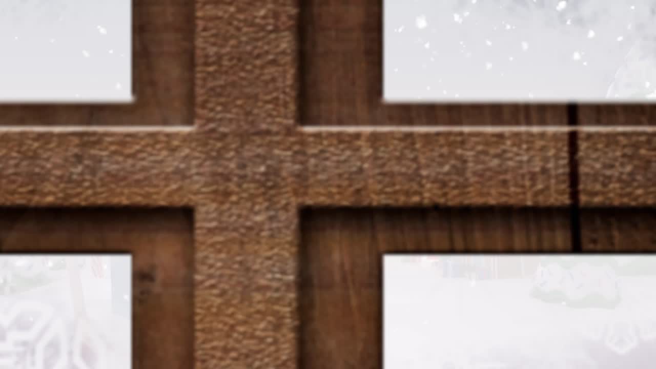 Digital animation of wooden window frame against snow falling on houses and trees on winter landscap