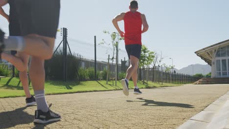 Men-running-outside-on-sunny-day