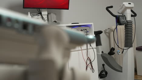 medical examination room with exercise bike and monitoring equipment