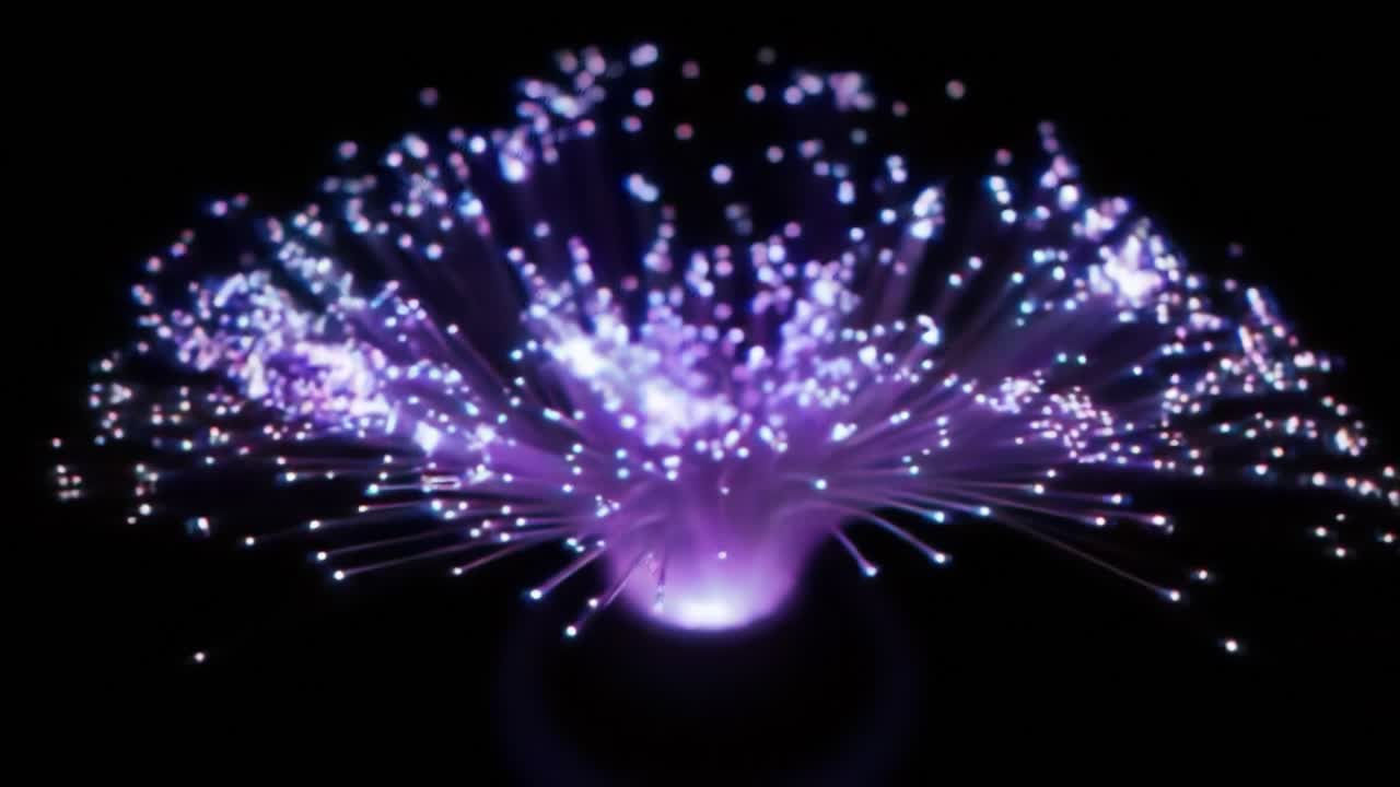 A vibrant electric plasma display illuminates a dark environment with dynamic light patterns. Colorful sparks radiate from a central point, creating a captivating visual experience.