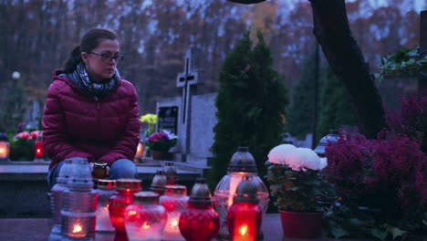 woman in grief at a grave