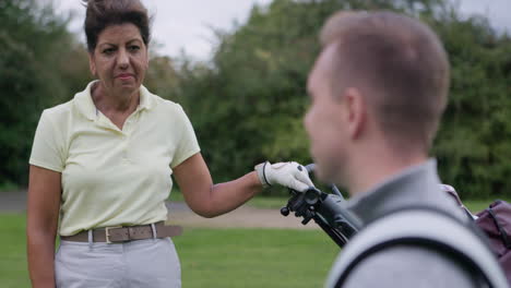 mature woman playing golf