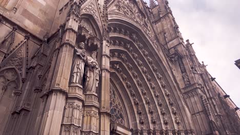 exterior of the historical and gothic cathedral of barcelona in catalonia, barcelona, spain. -  pan up