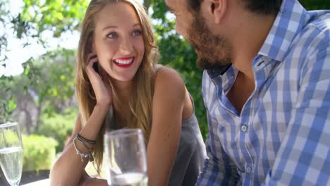 happy couple interacting with each other during lunch