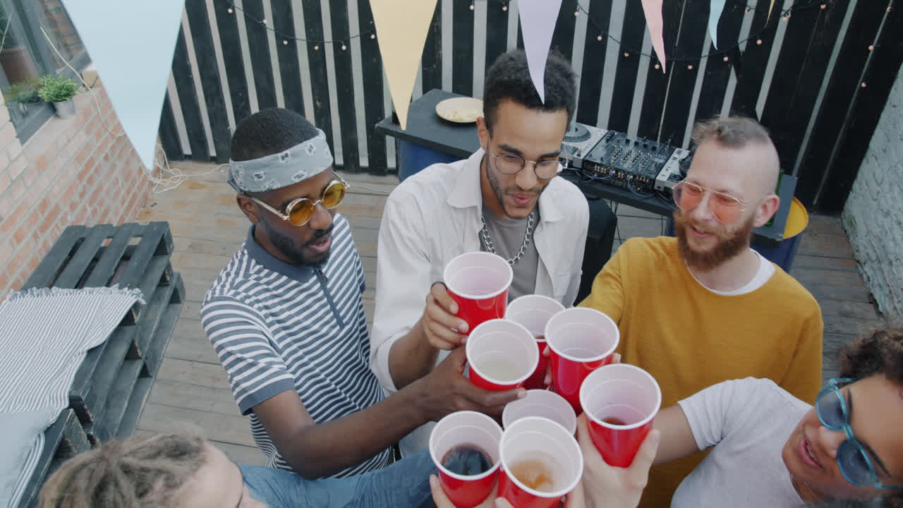Friends Celebrating on a Rooftop Patio