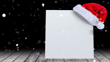 animation of snow falling over white card with copy space, christmas sant claus hat