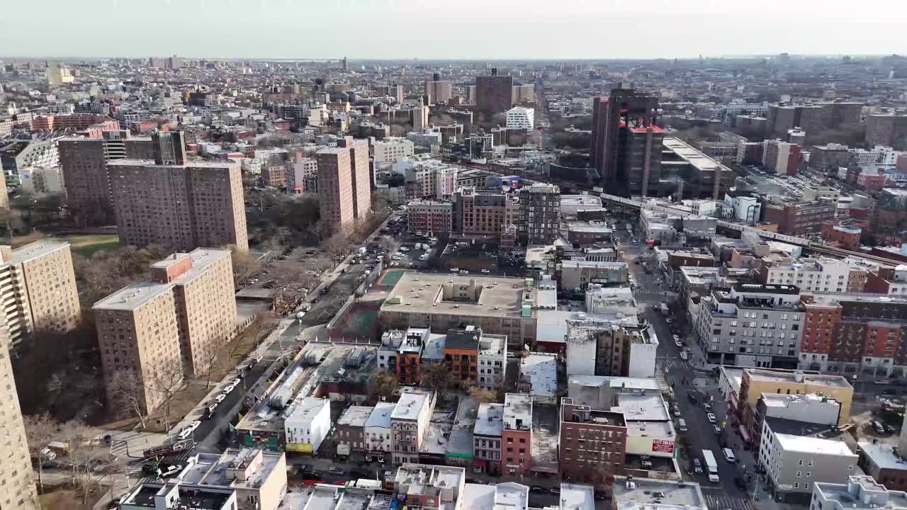 Horizontal drone circling shot over Varet Street in Brooklyn, showcasing New York’s urban charm, historic buildings, and dynamic cityscape with smooth aerial rotation.
