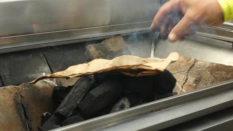 lighting charcoal in a grill