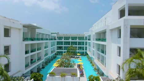 aerial view of a modern resort complex with a pool