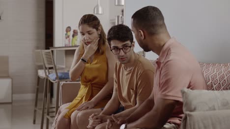 people comforting an upset person during a serious conversation