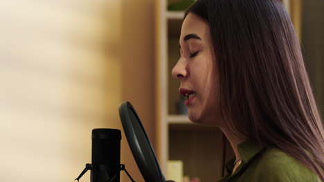 girl with microphone at home