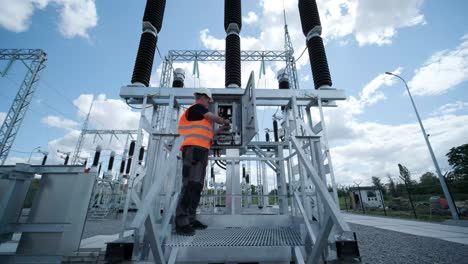 electrical engineers inspect the electrical systems at the equipment control cabinet