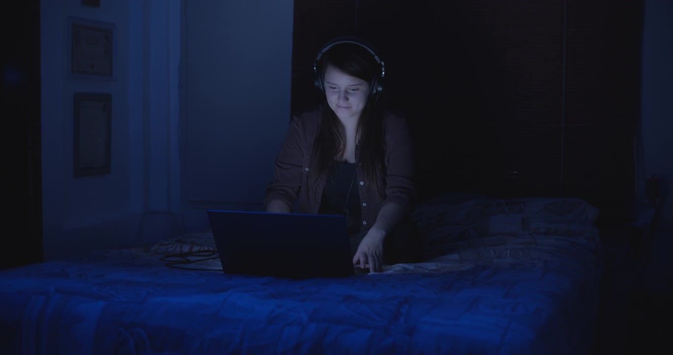 Woman listening to music at night
