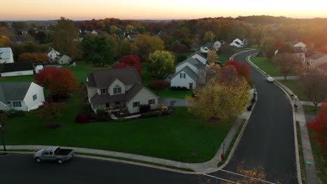 low aerial of single family homes in new residential development at sunset