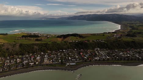 high altitude aerial view of the coastal town of kaikoura on new zealand's south island