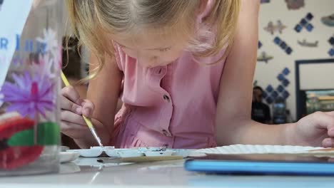 girl painting in art class