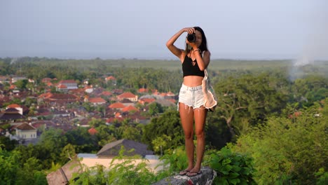 travel photographer girl taking photos of landscape at sunset,bali