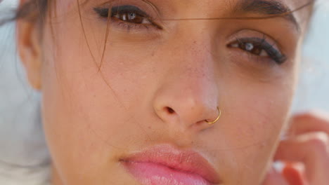 face, front and woman on vacation on a windy day