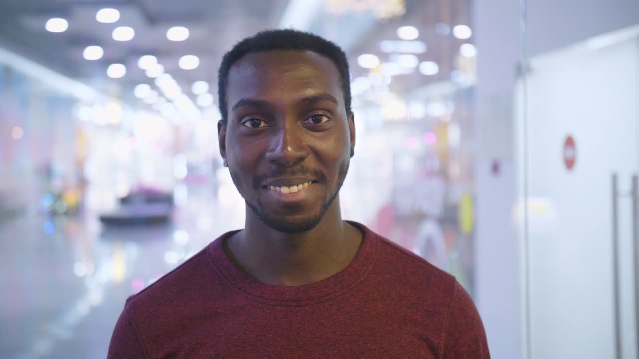 Smiling Man in a Shopping Mall