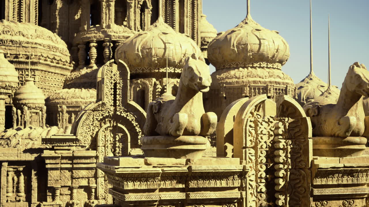 Intricate stone carvings of a historic temple featuring equine statues