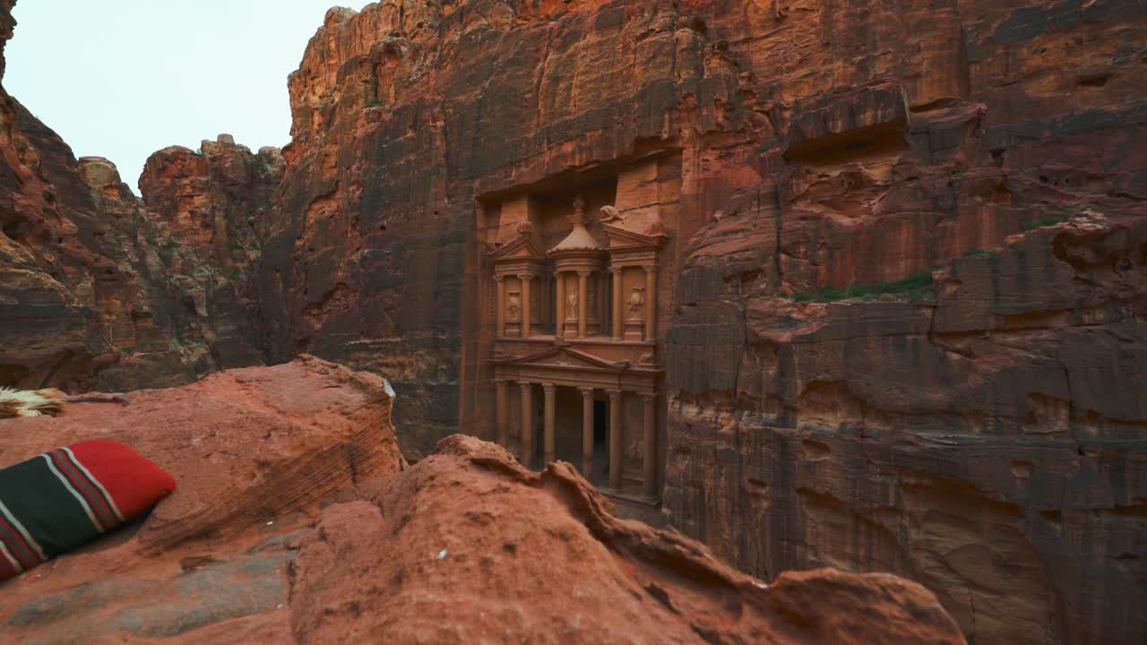 The Treasury at Petra, historic UNESCO heritage site carved into sandstone in Jordan seen from a scenic viewpoint above and sideways. Famous Indiana Jones Hollywood movie filming location and tourist destination Khaznet.