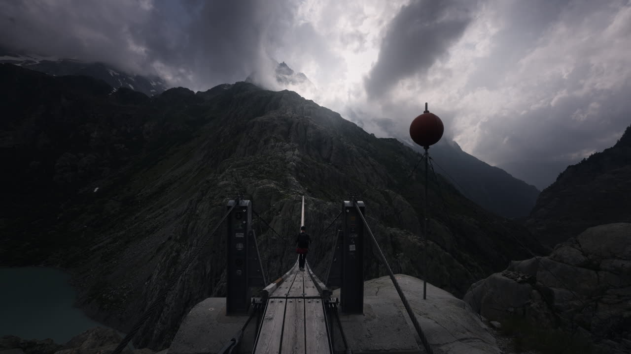 Walking a Suspension Bridge in the Alps