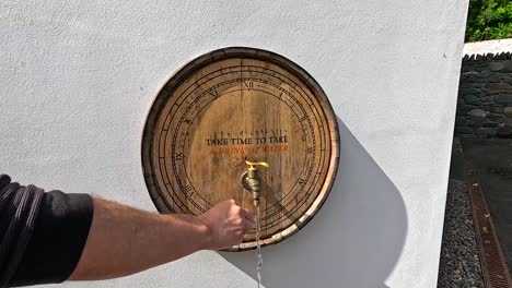 hand tapping barrel, liquid flowing out