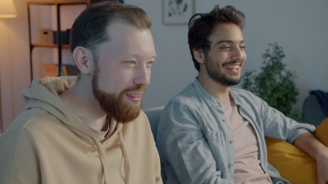 Two Friends Enjoying Beer at Home