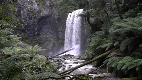 Waterfall-flowing-into-river-steam-in-rainforest