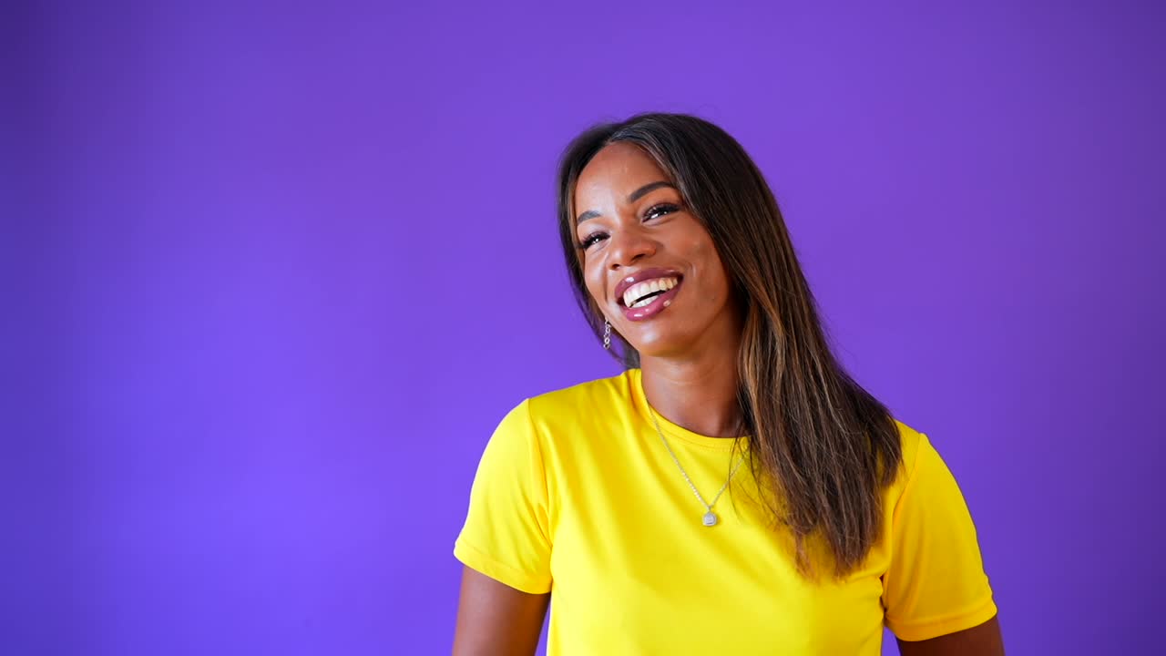 Portrait of a Smiling Woman in Yellow Shirt