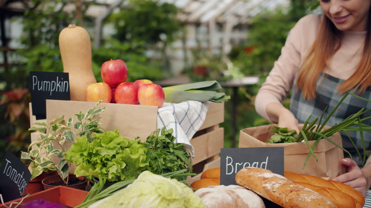 Woman Selling Fresh Produce at a Farmer's Market