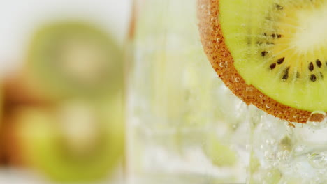 kiwi slice in a sparkling beverage