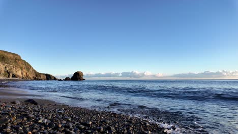 Slowmotion-waves-on-shingle-beach-late-evening-winter-afternoon-Copper-Coast-Waterford-Ireland