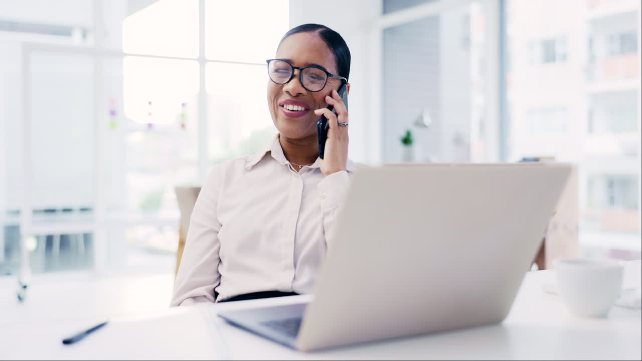 Phone call, laptop and a happy business woman